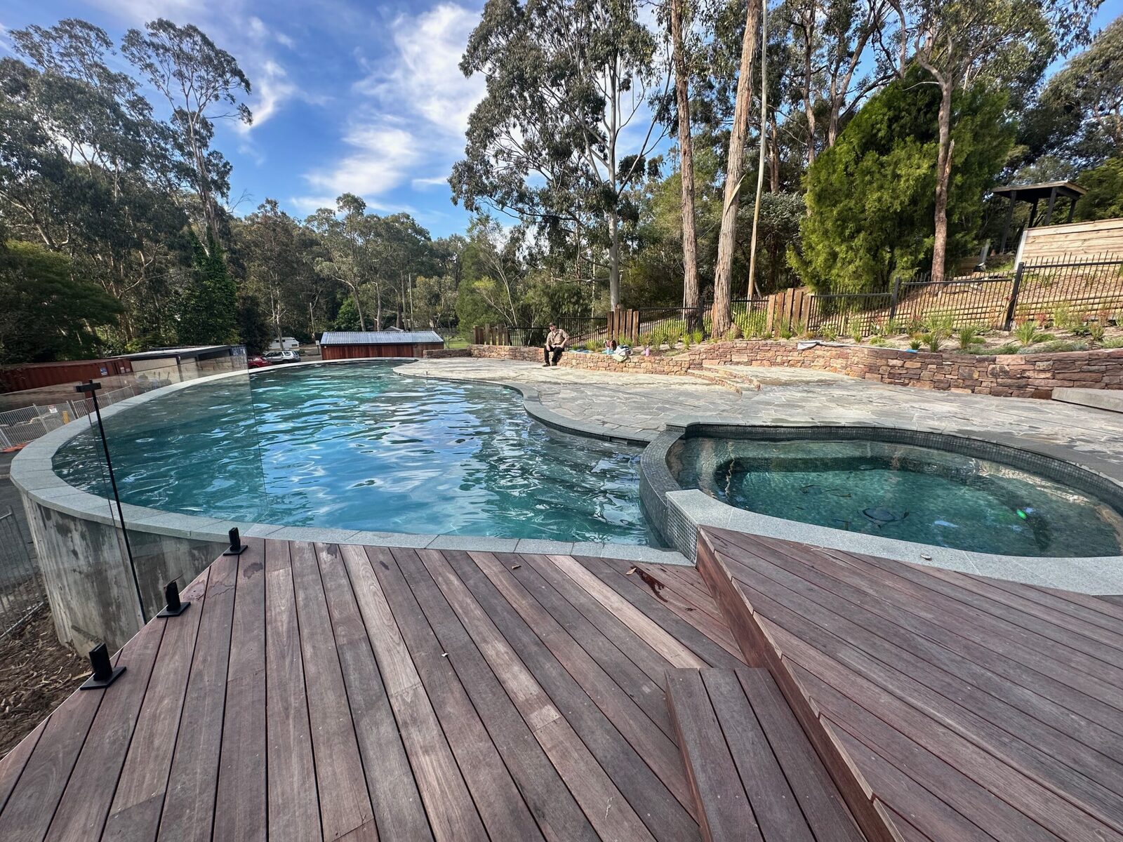 Campers at the outdoor pool at Oasis Camp